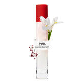 Glossier You travel bottle front view showing compact design and portability