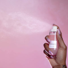 Glow Recipe bottle mid-shake showing bi-phase formula for hydration