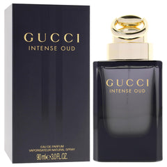Gucci Intense Oud spray in hand demonstrating application and control