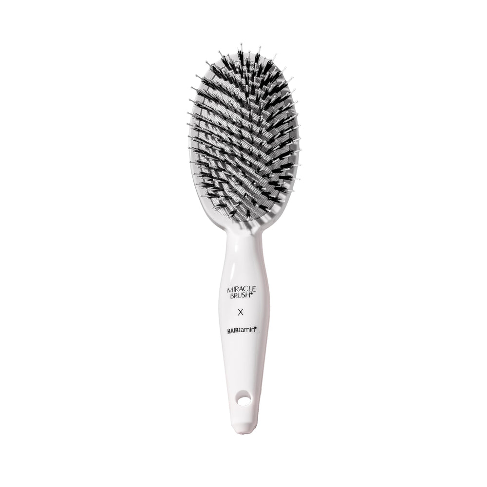 HAIRtamin front view of Miracle Brush showing paddle shape and polished finish benefit