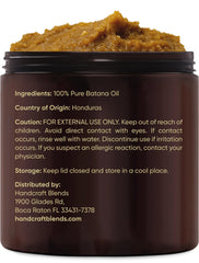 Warmed Handcraft Blends batana oil in hands ready to apply for deep hydration