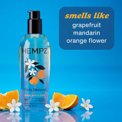 Applying Hempz Fresh Citrus oil to forearm to hydrate and soften dry skin