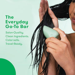 HiBAR conditioner bar smoothing wet hair to show detangling and lightweight moisture
