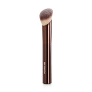 Hourglass brush front view showing angled head for precise application
