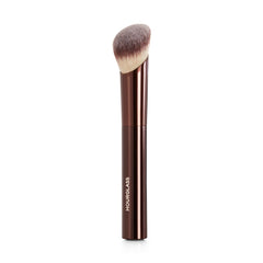 Hourglass brush front view showing angled head for precise application