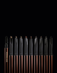HOURGLASS spoolie blending product on brow for natural-looking, groomed arch