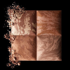 Hourglass bronzer swatch on skin demonstrating buildable warm tone and blendability