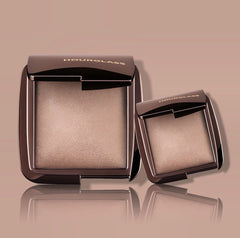 Hourglass Dim Light applying to cheek with brush demonstrating subtle blurring of pores and natural radiance