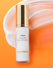 HOURGLASS primer being applied to cheek illustrating blurring and makeup prep benefit