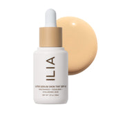 ILIA front packaging showing the Super Serum Skin Tint bottle with SPF benefit