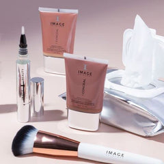 IMAGE Skincare pack held in hand showing compact travel-friendly size