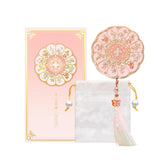 Imperblooms closed compact top view showing pink floral artwork and elegant finish