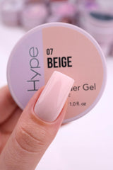 IN.HYPE gel being sculpted on a nail form showing precise shaping benefit