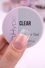 IN.HYPE gel being applied over sculpting forms to build custom nail extensions