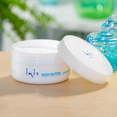 Close-up of creamy body butter texture highlighting Inis smooth absorbency benefit