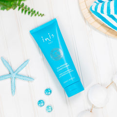 8.5 fl oz bottle held to show scale, Inis size and travel-friendly benefit