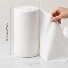 Intrinsics cotton roll in use during facial demonstrating lint-free removal benefit