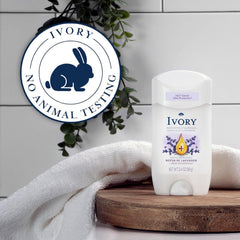 Ivory deodorant stick held in hand showing 2.4 oz scale benefit travel-friendly size