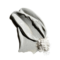 Jack Black product texture on hand revealing clay-rich consistency and exfoliation benefit