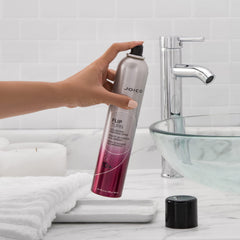 Joico styling demo sprayed upside-down at roots for instant volume and lift benefit
