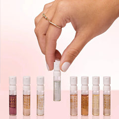 KAYALI minis styled with vanilla pod and peach to convey scent notes and layering ideas