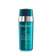 KÉRASTASE bottle front view showing product benefits and sleek packaging