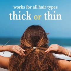 K'lani elastic holding a medium ponytail securely without creasing for gentle grip