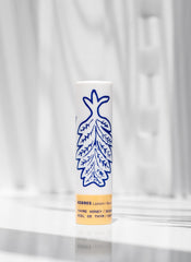 KORRES lip butter applied on lips in lifestyle setting for subtle golden glow