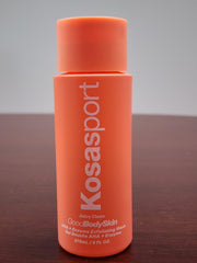 Kosas body wash in use on arm showing smoother skin result