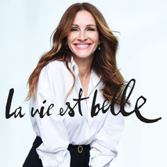 Lancôme La Vie Est Belle bottle in hand showing 6.7 fl oz size for travel-friendly use