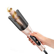 LANDOT front view of curling iron showing one-button auto wrap and ergonomic grip benefit