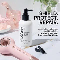 L'ANGE HAIR bottle in hand showing size and travel-friendly convenience