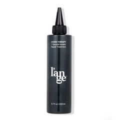 L'ANGE HAIR front bottle showing product branding and easy-grip design for fast use