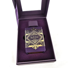 Lattafa Bade'e Al Oud Amethyst bottle close-up highlighting floating shape and spray nozzle, shows craftsmanship