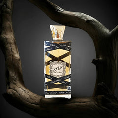Lattafa Oud Mood bottle in evening outfit scene conveying warm fragrance benefit