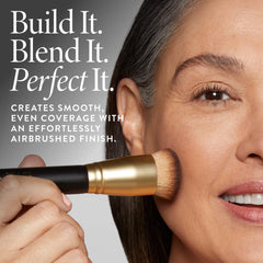 LAURA GELLER brush held in hand to show size and control benefit