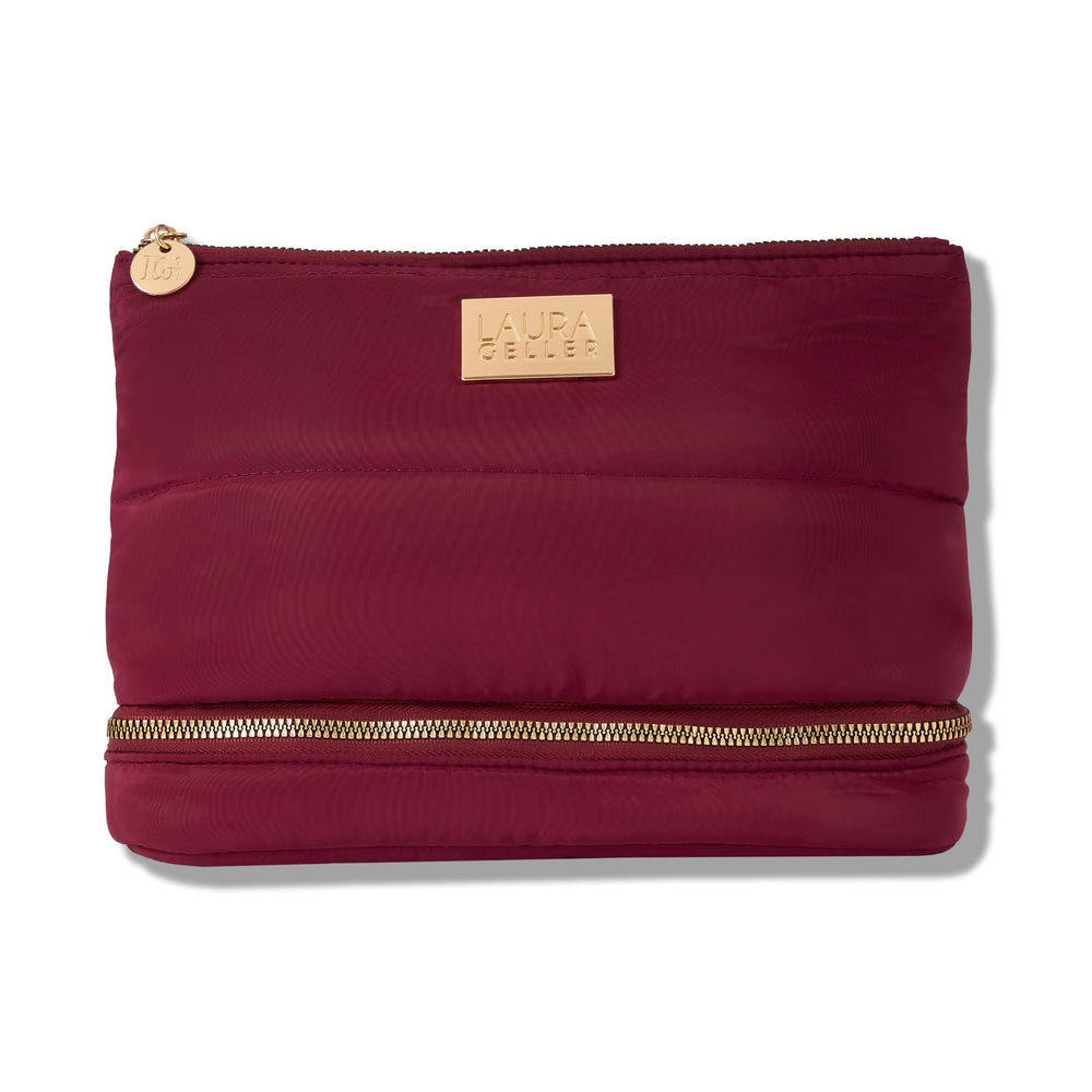 LAURA GELLER front view of burgundy quilted makeup bag showing shape and size