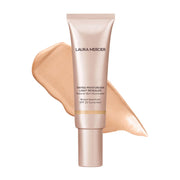 Laura Mercier bottle front view showing brand and luminous finish benefit