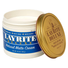 Layrite cream texture close-up on fingertip demonstrating smooth spreadability