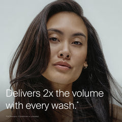 Living Proof conditioner being applied to wet hair for smooth detangling