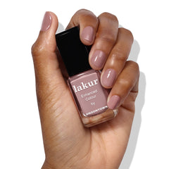 LONDONTOWN lakur bottle angled to highlight color depth and rich pigment benefit