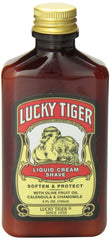 Man shaving with Lucky Tiger cream in bathroom, illustrating reduced irritation and smooth shave