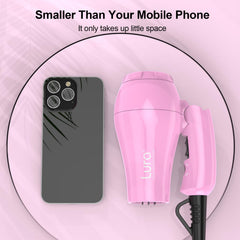 LURA folded beside a phone demonstrating compact size for effortless packing