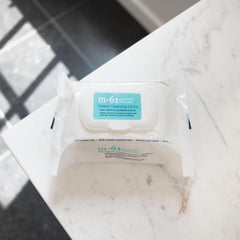 m-61 cloth in hand removing makeup demonstrating quick cleansing benefit