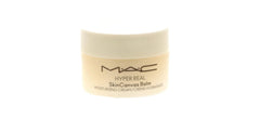 MAC Hyper Real SkinCanvas balm next to travel items illustrating portable convenience
