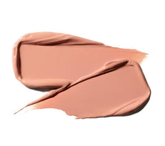 MAC Ximal lipstick held in hand in lifestyle setting showing size and everyday use