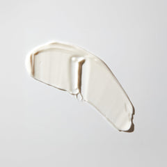MALIN+GOETZ moisturizer on hand demonstrating quick absorption benefit