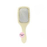 Mane mini brush front packaging shows compact detangler and benefits