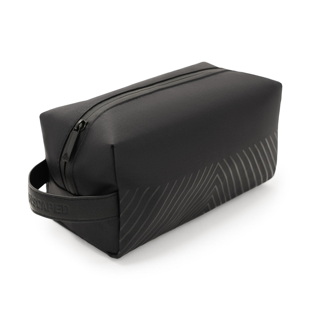 MANSCAPED front view showing compact organized toiletry bag benefit: travel-ready