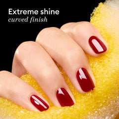 Manucurist applied in salon setting curing under LED lamp for durable shine